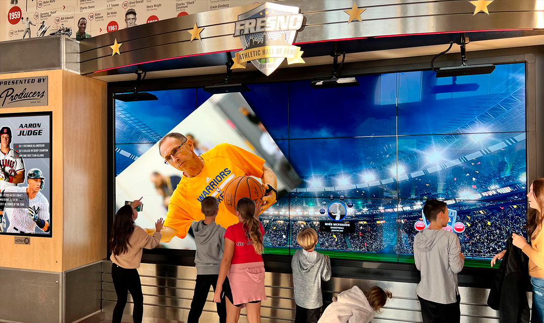 Kids interacting with Hall of Fame wall